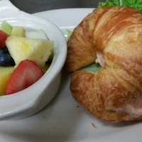 Shrimp-or-chicken-salad-on-a-croissant-with-a-side-of-fresh-fruit